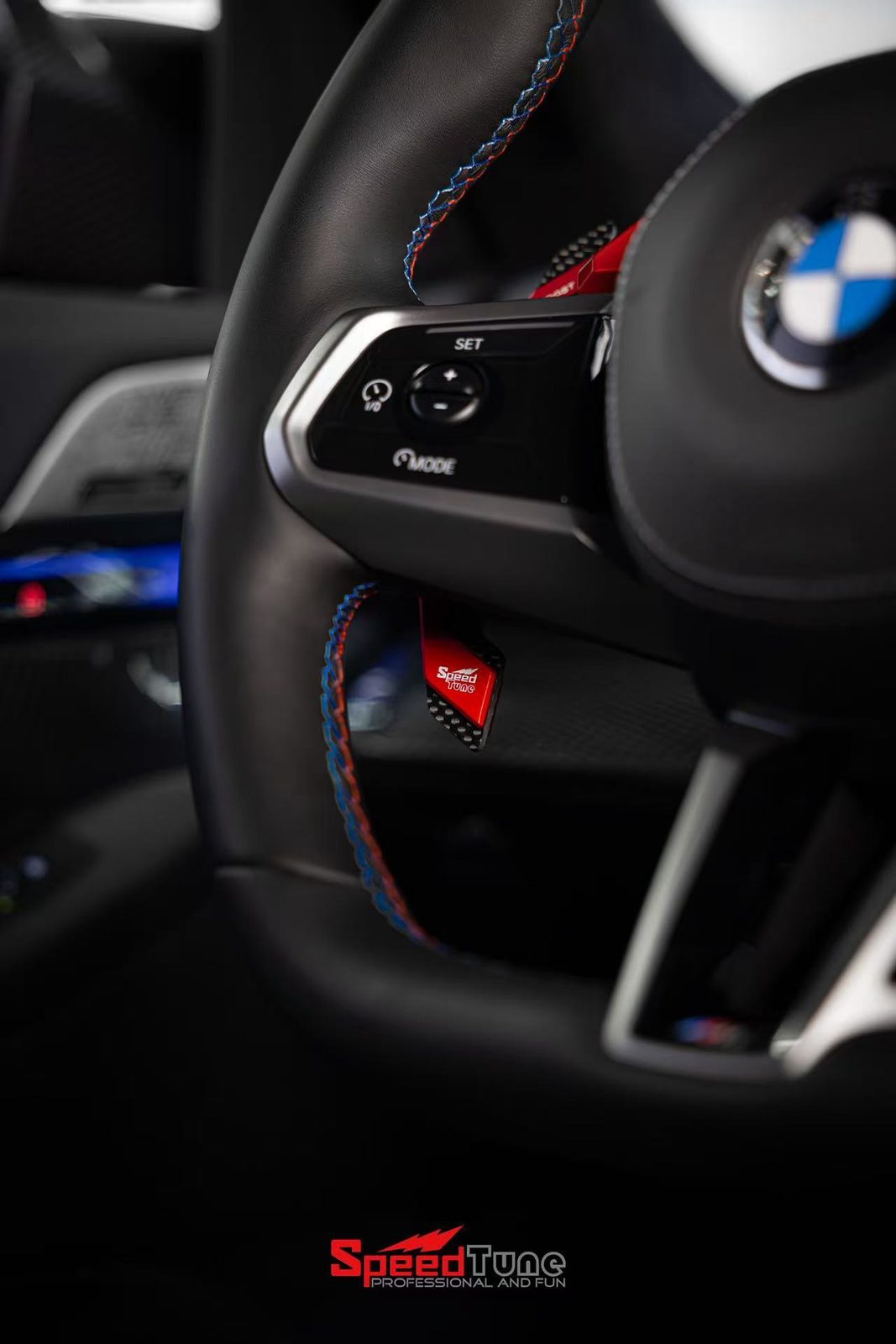 Red magnetic paddle shifter close-up, fitted